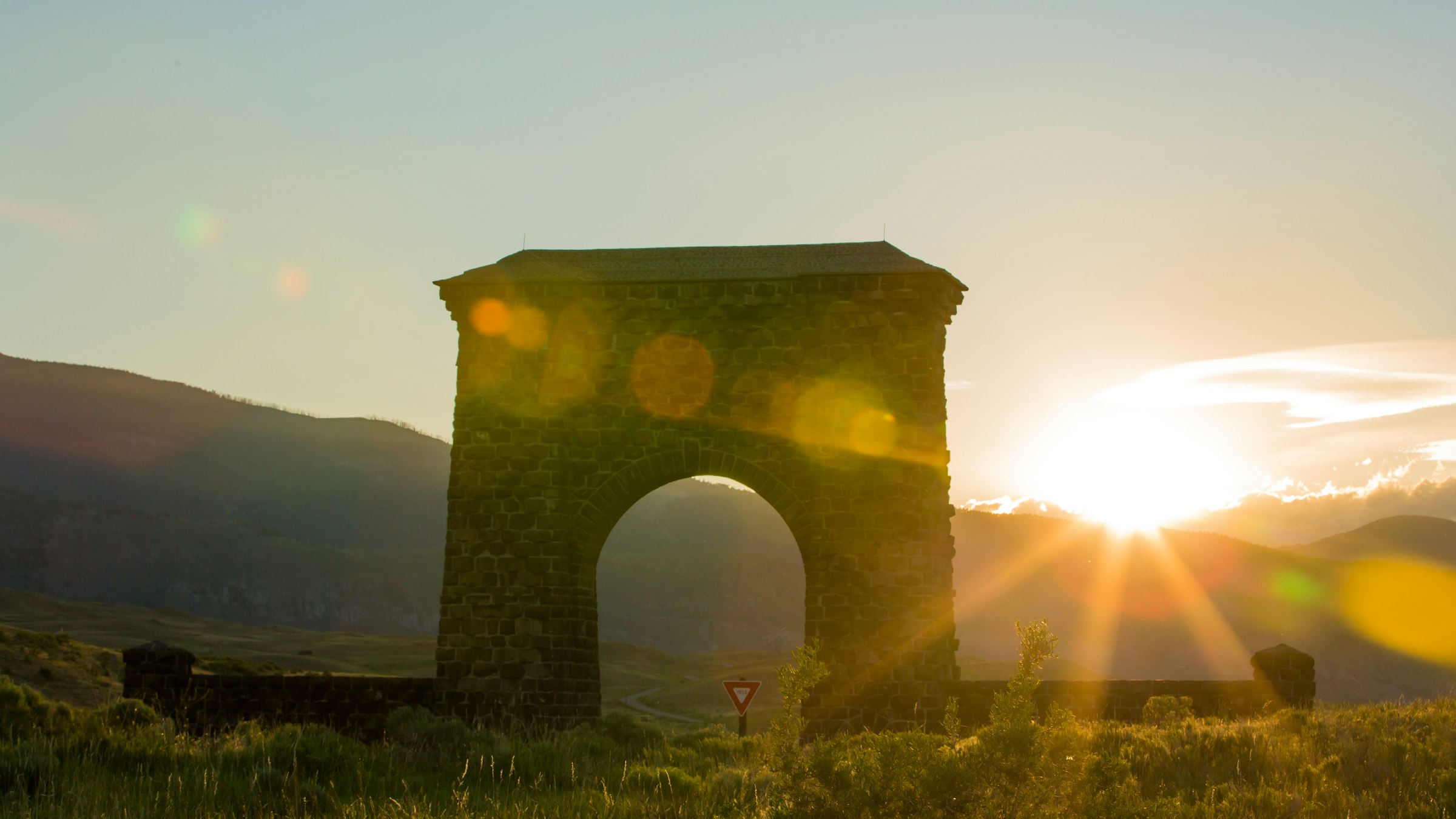 The Roosevelt Arch at the north entrance of Yellowstone at sunset